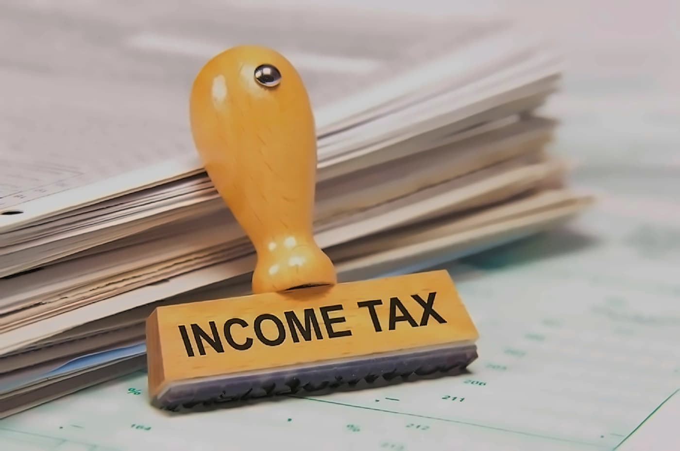 ITAT reduces NRI's 200% penalty to 50% in tax case